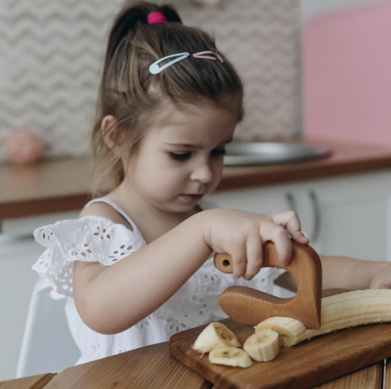 Wooden safety knife and apron set.